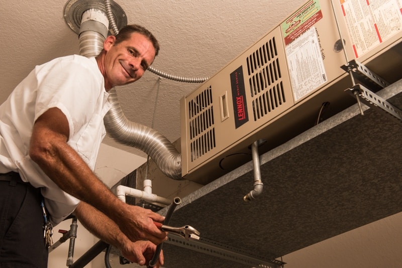 man fixing equipment