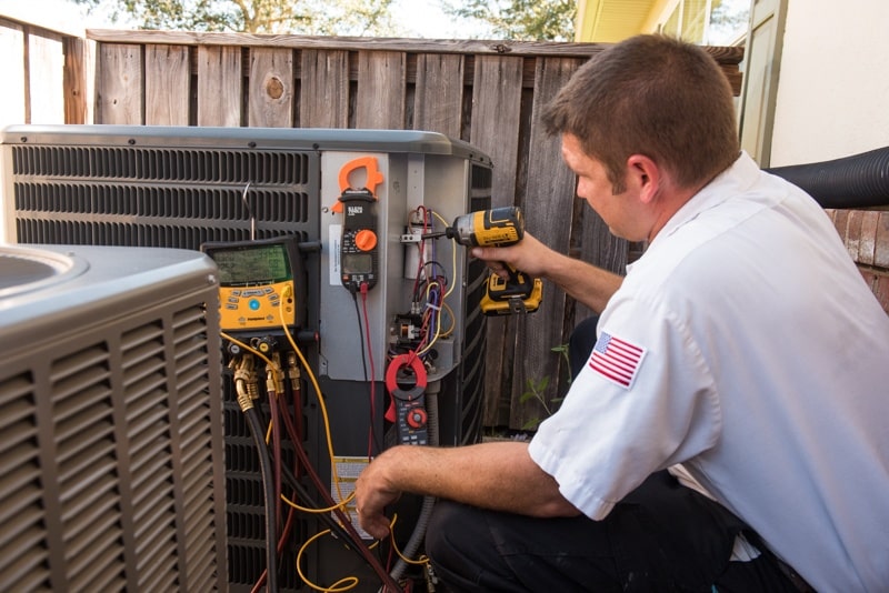 man fixing equipment